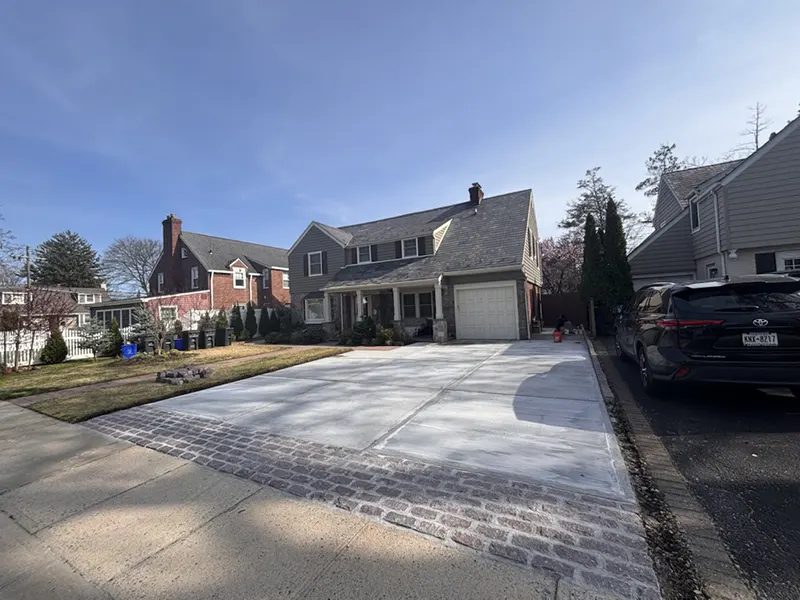 Side Garage & Driveway Restoration – Rockville Centre, NY - Driveway and Cobblestone Repointing Project by Zavza Seal LLC