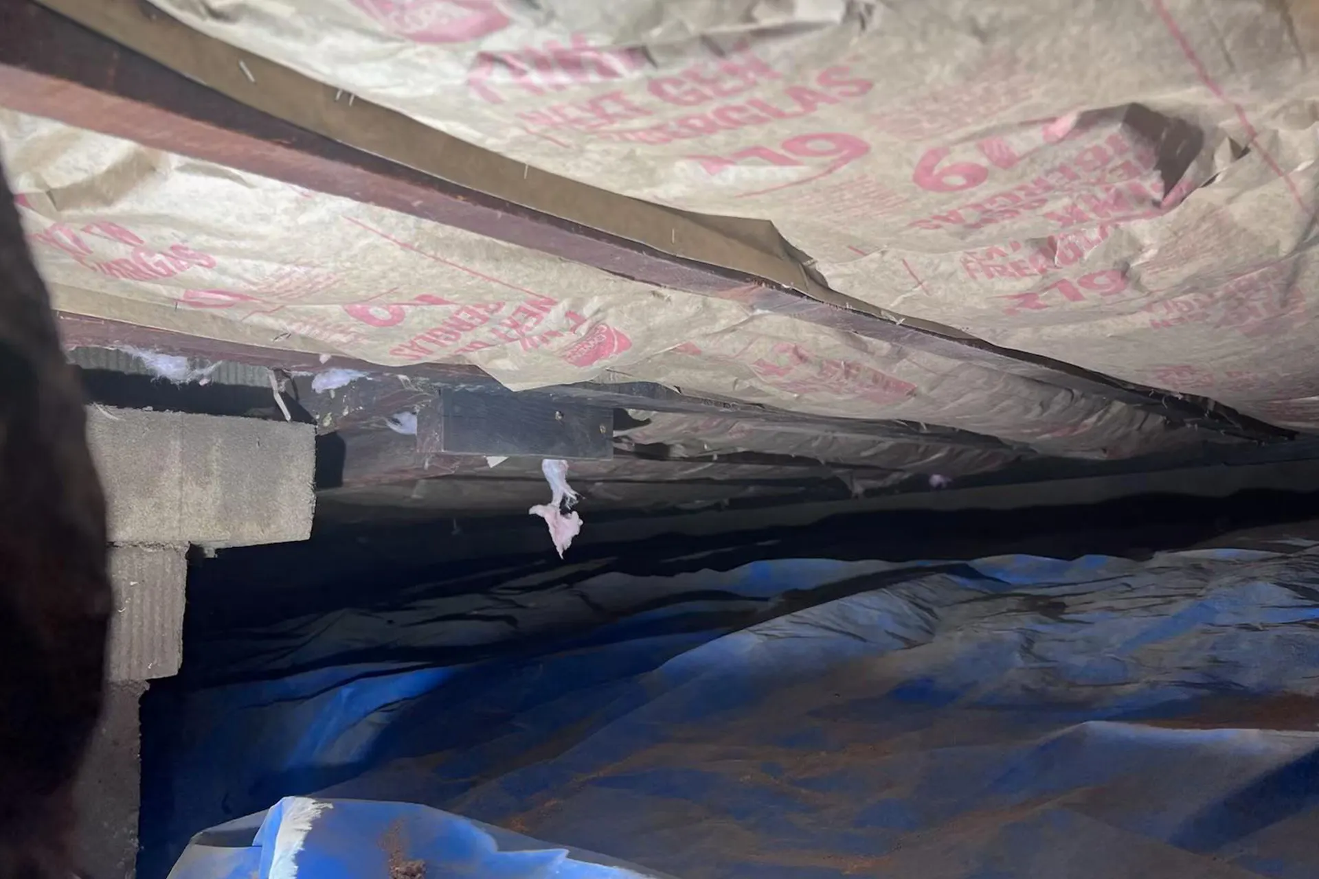 Benefits of Crawl Space Encapsulation - A Brooklyn Crawl Space with a Vapor Barrier Installed on the Ground
