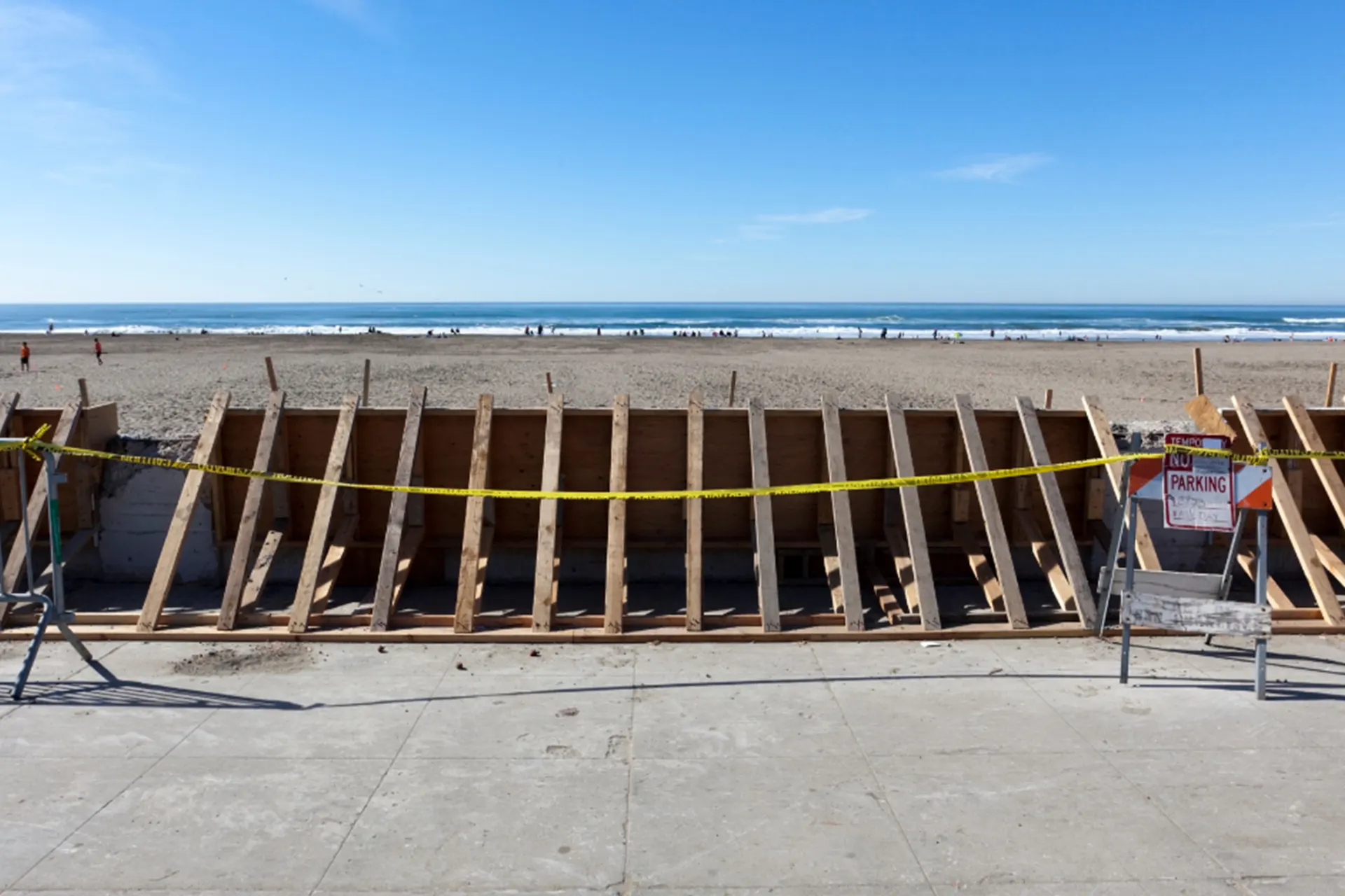 Seawall Repair Services for New York Coastal Communities - A Seawall in a Barricaded Beach Area Being Repaired