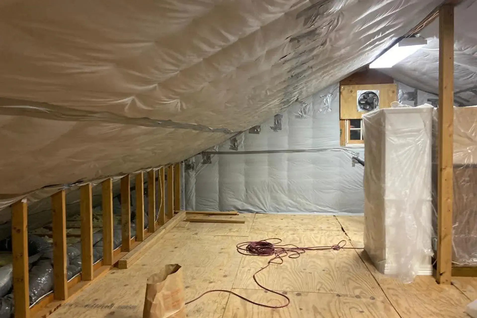 eave insulation upgrade Williston Park NY dense pack cellulose installed in joists and gable spaces air sealing and vapor barrier energy efficiency improvement
