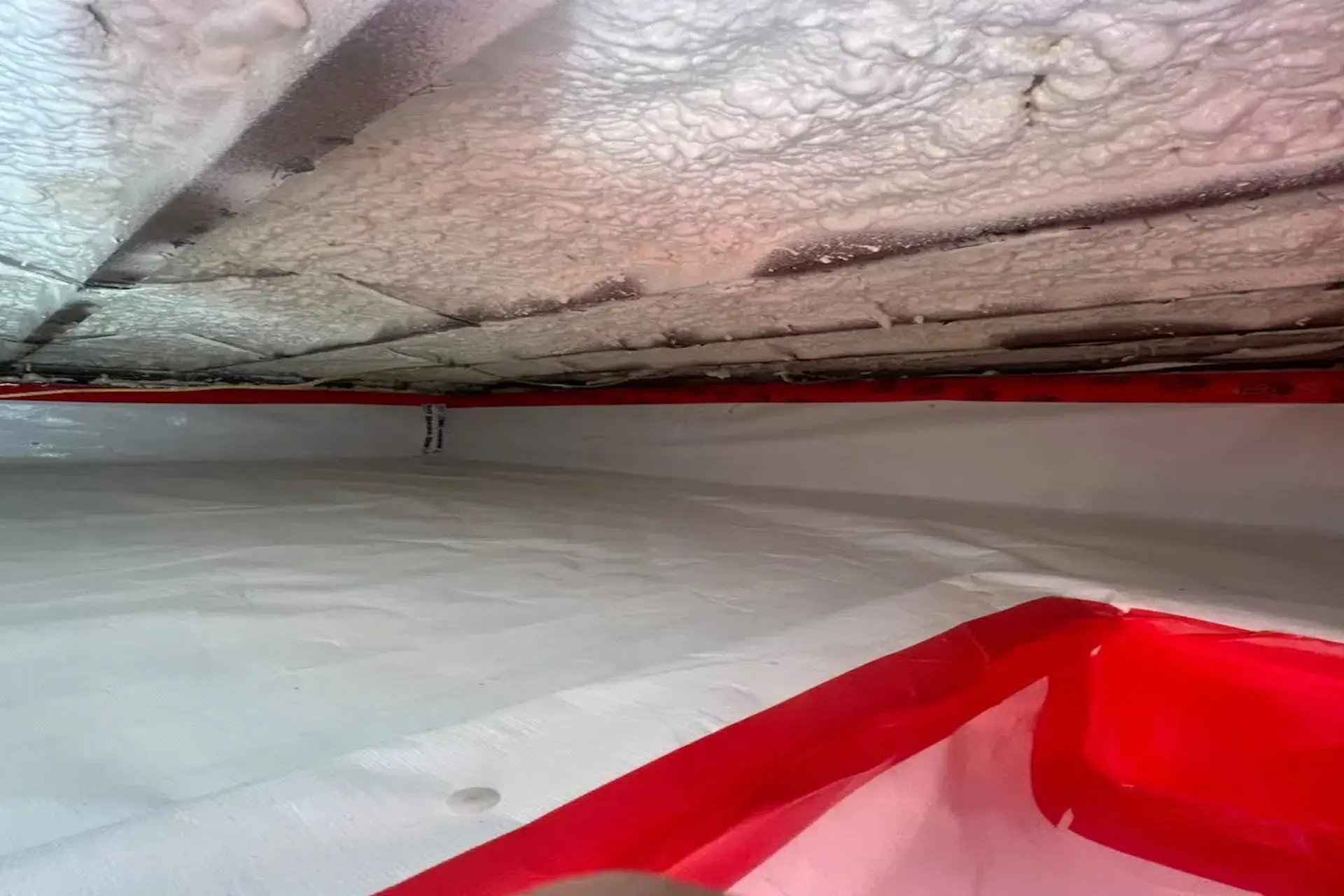 Crawl space encapsulation and spray foam insulation project in West Hempstead NY featuring sealed crawl space walls, vapor barrier installation, attic insulation, and moisture protection upgrades.