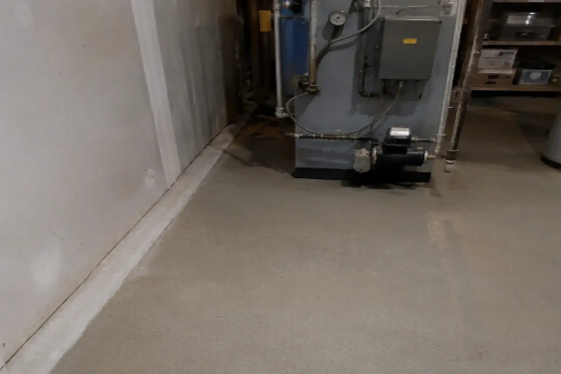 featured-photo-of-the-repaired-basement basement waterproofing and concrete slab repair project in Brooklyn NY with interior drainage system and restored concrete floor