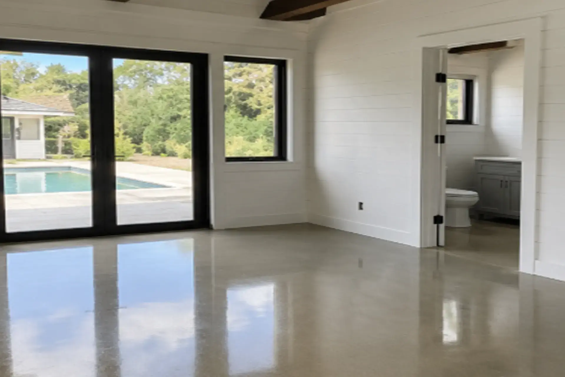 finished-polished-concrete-floor-featured Polished concrete floor installation in a pool house in East Hampton NY with smooth glossy finish completed by Zavza Seal.