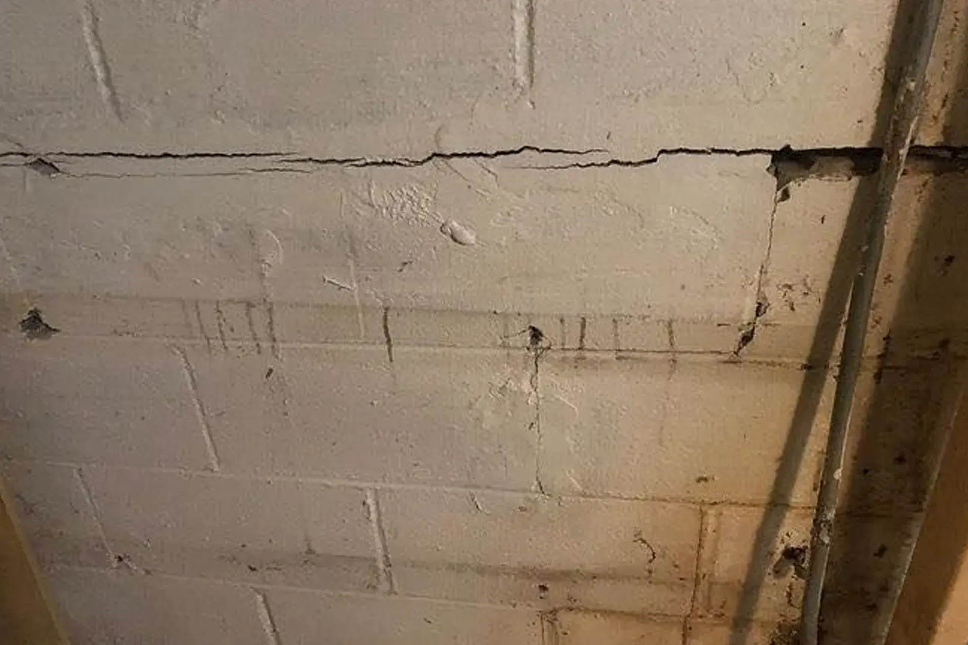 A horizontal structural foundation crack in a home in Brooklyn, NY  

