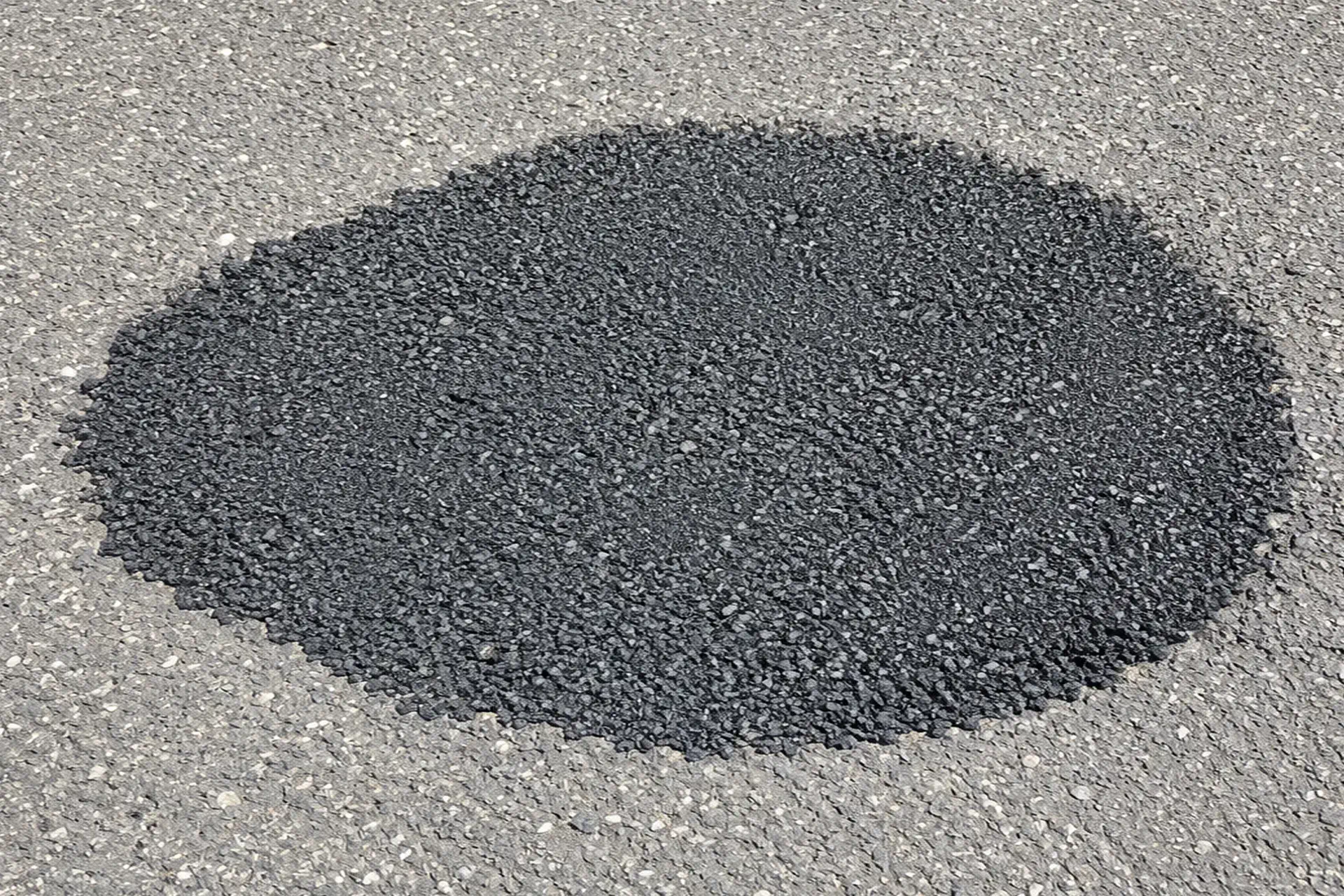 new-asphalt-installed-over-stabilized-and-compacted-ground-featured Completed sinkhole repair and asphalt restoration in Woodside NY showing newly installed asphalt over stabilized ground.