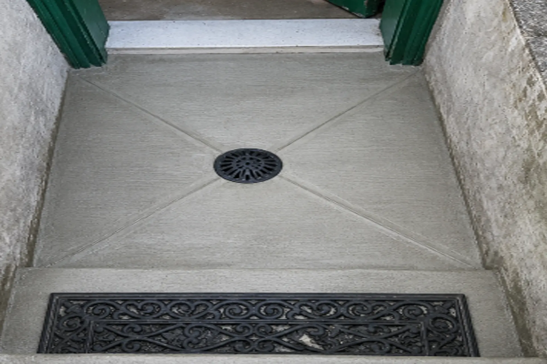 new-reinforced-concrete-stairway-featured Completed basement stairway drainage repair in Brooklyn NY featuring a new sump pump system, center drain, reinforced concrete landing, and improved water management.