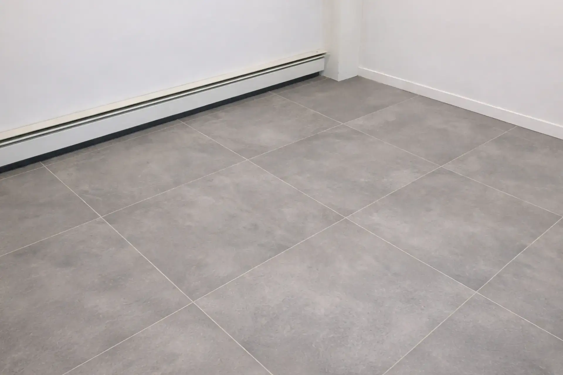 waterproofed-basement-floor-featured Waterproofed basement floor with large format tile installed over Schluter DITRA membrane in Bronx NY