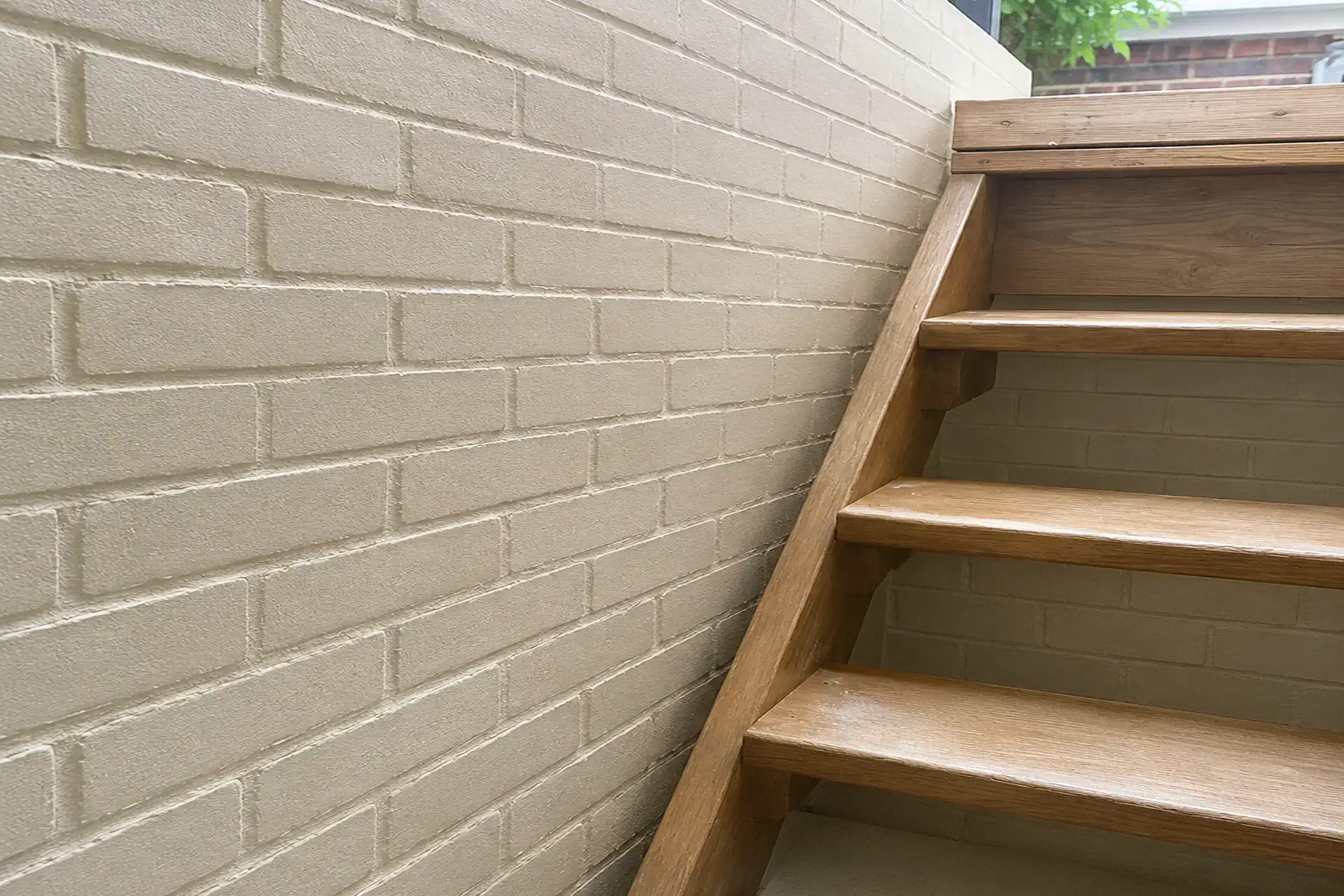 brickwork-and-repaired-mortar-joints-featured Completed masonry cellar entrance waterproofing project with restored brickwork and repaired mortar joints at a home in Bellport, NY.