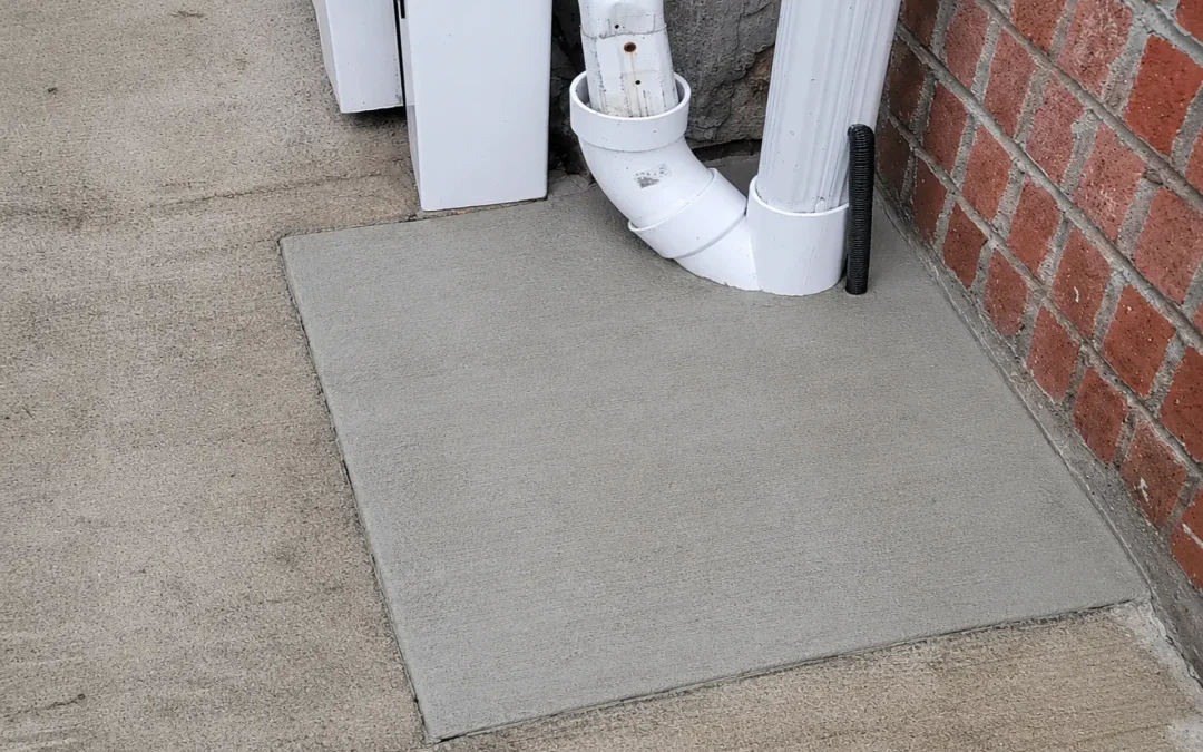 Case Study: Downspout Drain Repair and Concrete Restoration in Flushing, NY