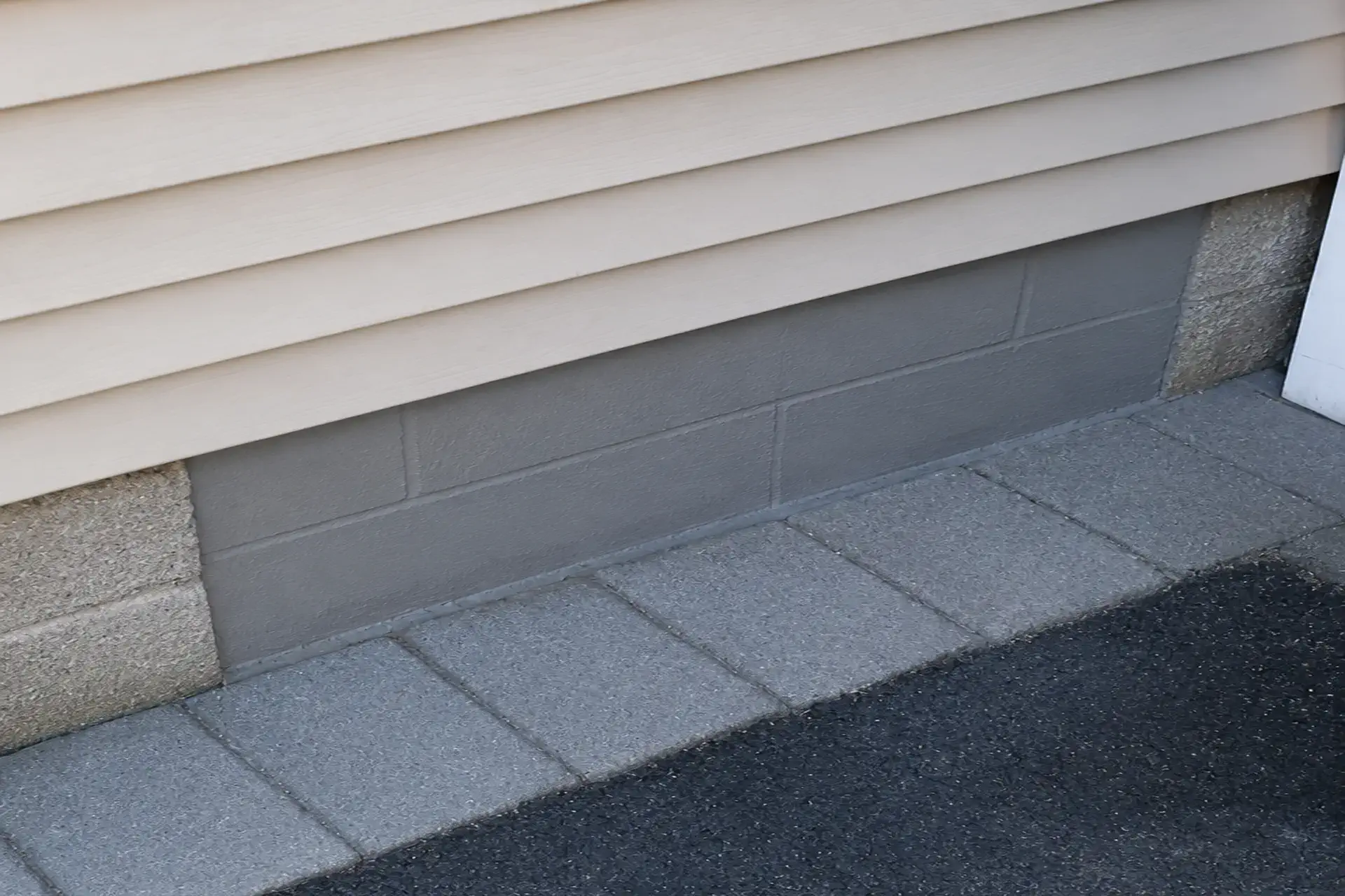 finished-crawl-space-and-basement-waterproofing-featured Completed crawl space and basement waterproofing project in East Islip, NY featuring a French drain system, reinforced structural supports, and new crawl space access.