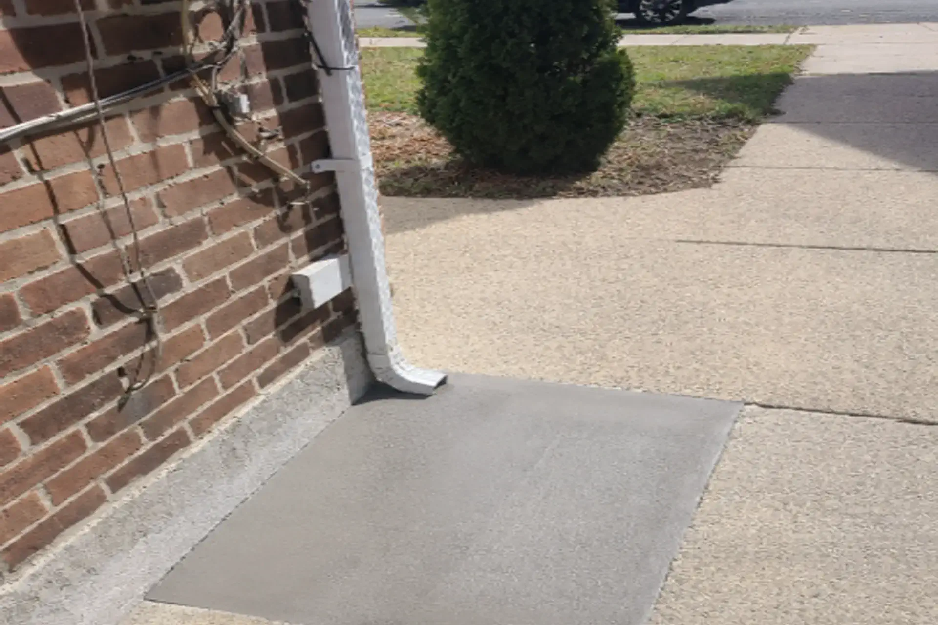 foundation-joint-downspout-drainage-repair-featured Foundation joint sealing and underground downspout drainage repair completed at a residential home in Howard Beach, NY.