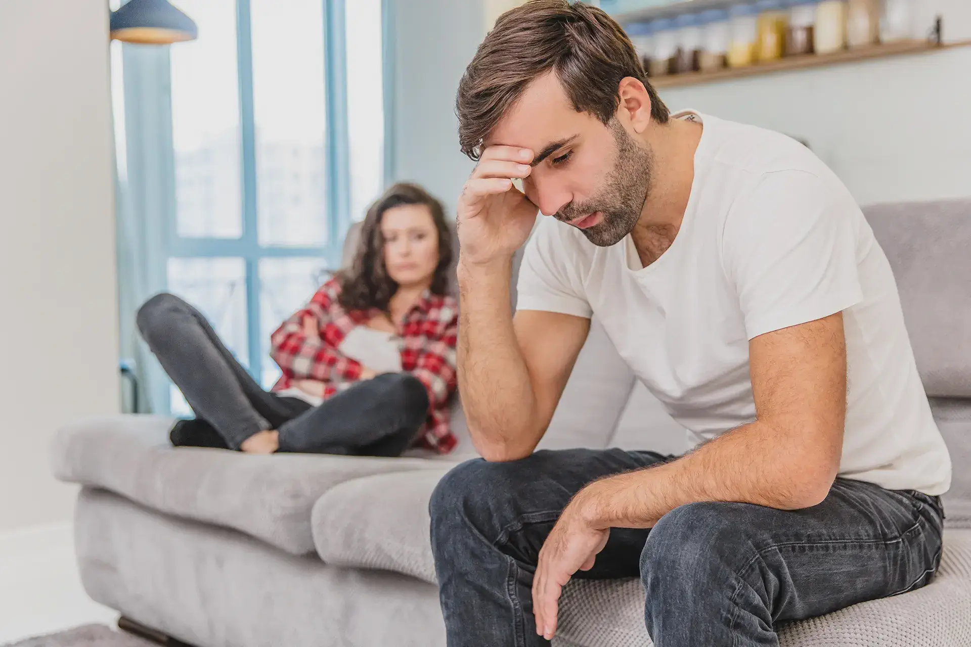 A sad couple worried about the costs of their heating and cooling bills in Queens, NY and thinking of a solution like an EIFS installation in their home in Queens, NY<br />
