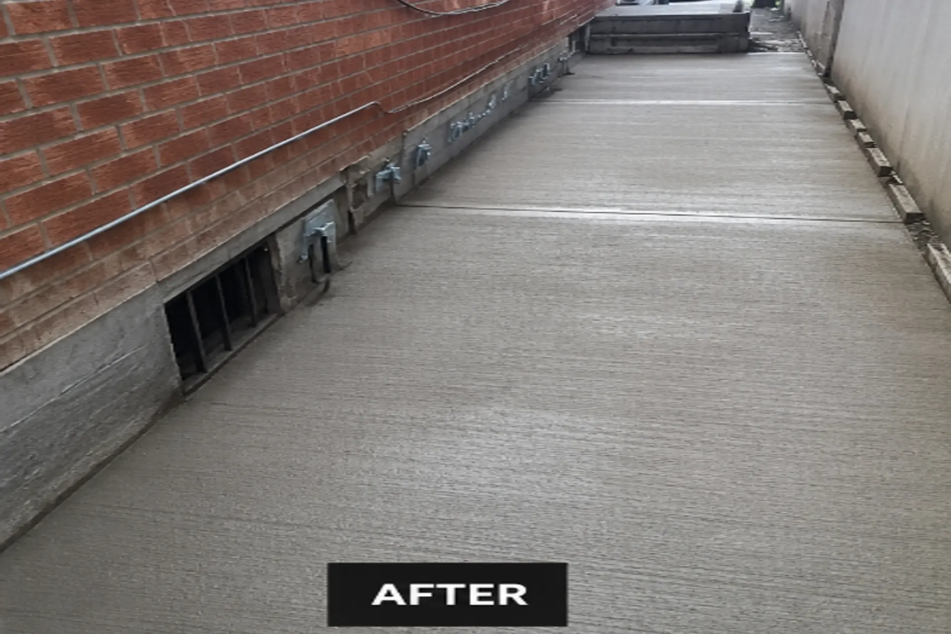 newly-installed-reinforced-concrete-slab-featured Completed helical pile foundation stabilization project with new reinforced concrete slab at a settling home in Brooklyn, NY.