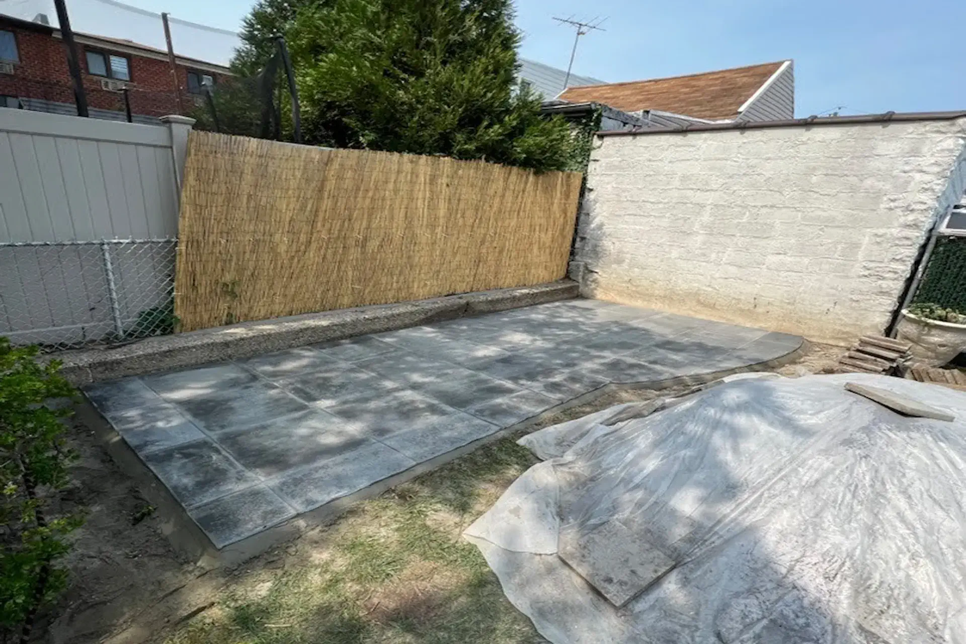 backyard-paver-patio-featured New paver patio extension completed in a Flushing NY residential backyard.