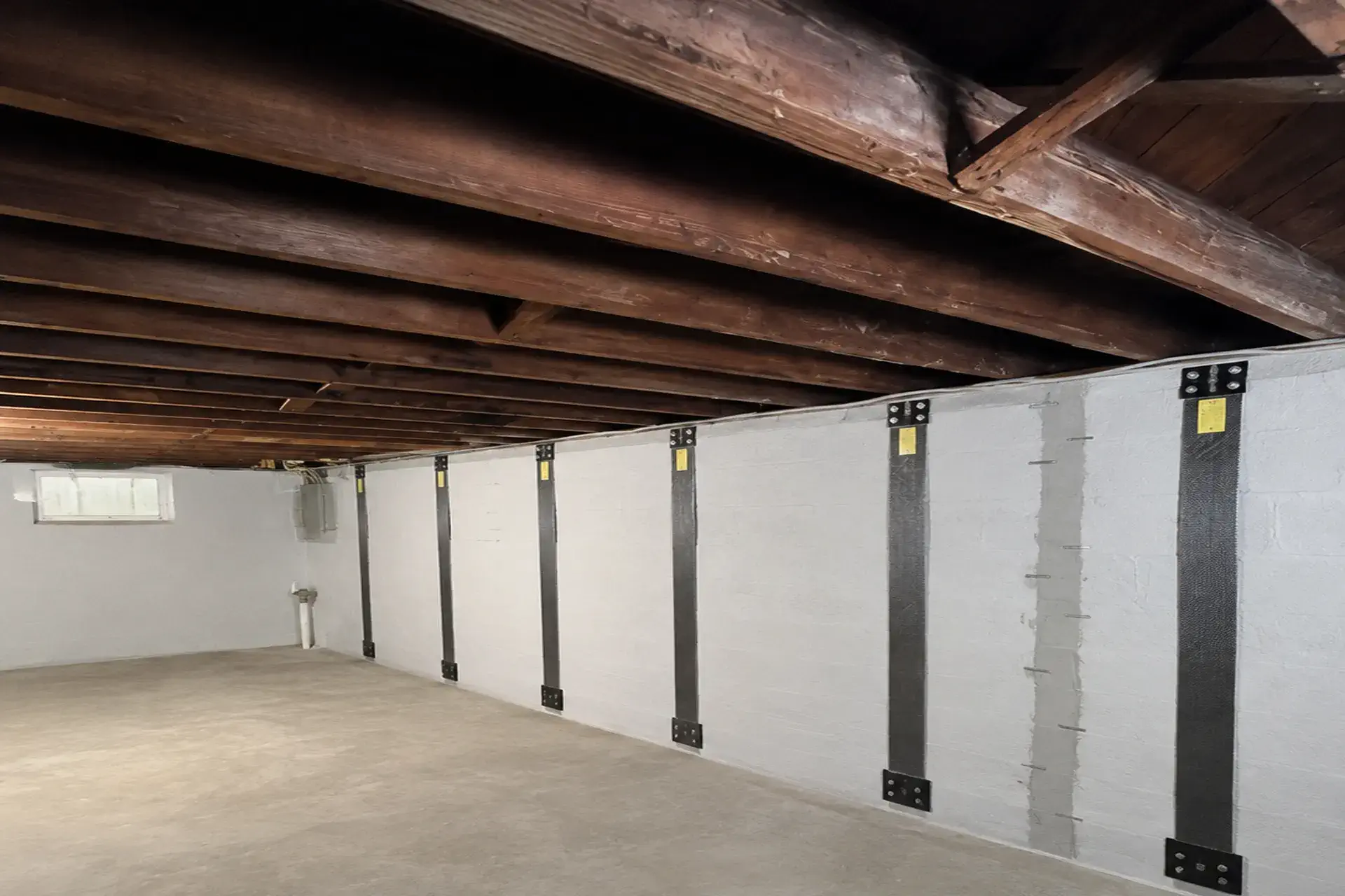 cinder-block-foundation-wall-featured Bowing cinder block foundation wall stabilized with carbon fiber reinforcement in Wyandanch NY.