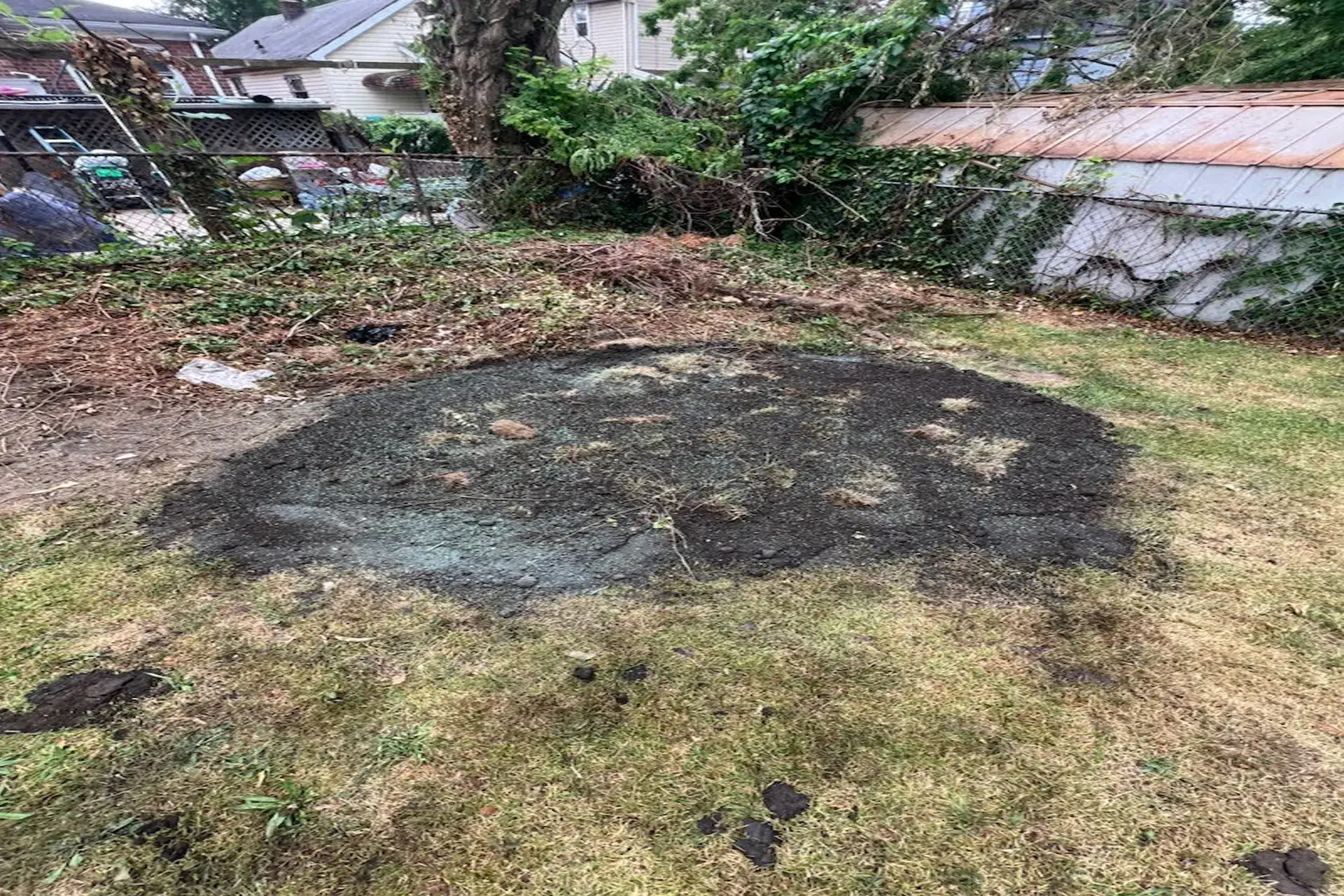 completed-backyard-sinkhole Completed backyard sinkhole repair in Jamaica, NY with restored grading and stabilized ground conditions.