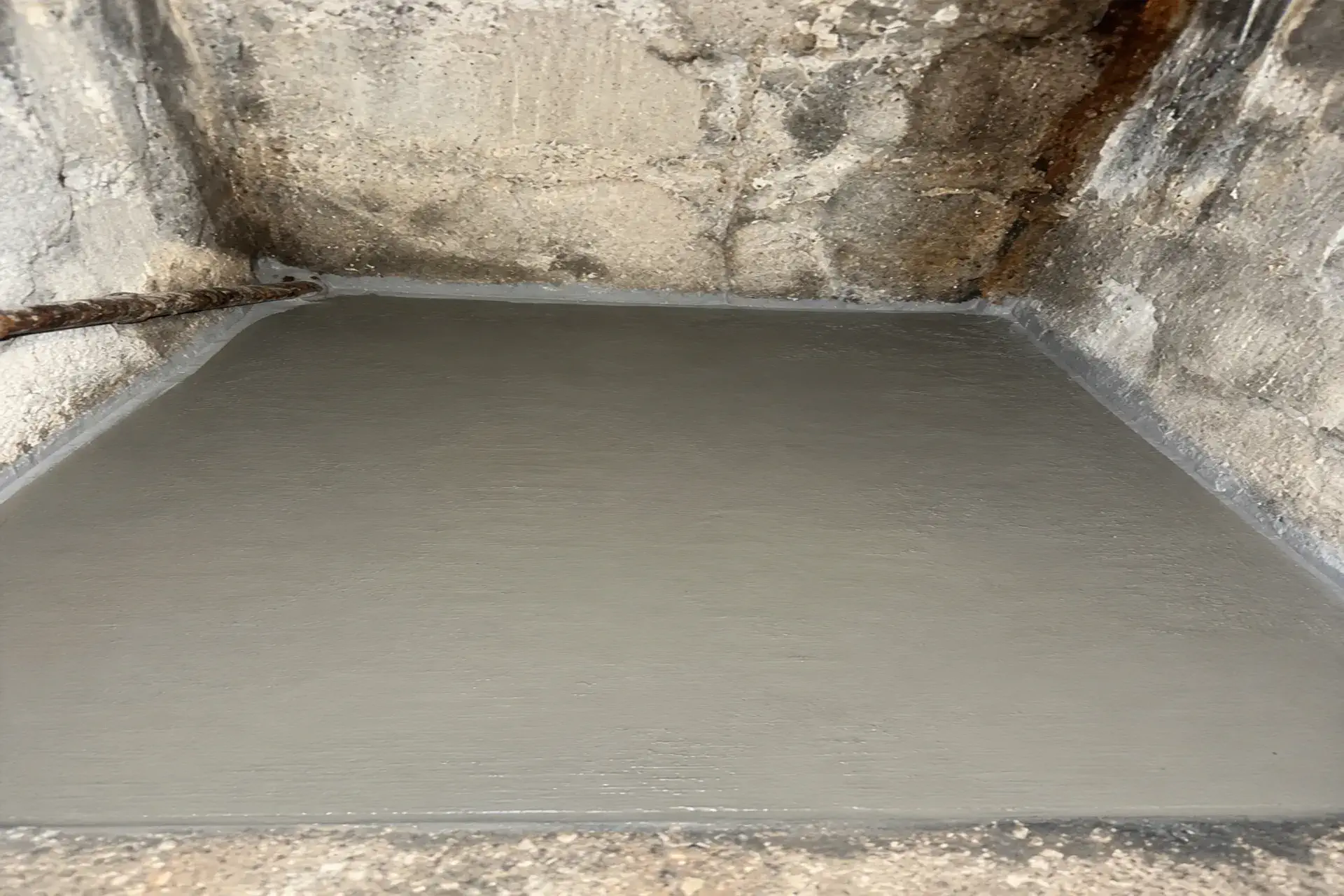 completed-cellar-entrance-drainage-improvement Completed cellar entrance drainage improvement project in Brooklyn, NY featuring a new drywell system, concrete landing, and water intrusion investigation.