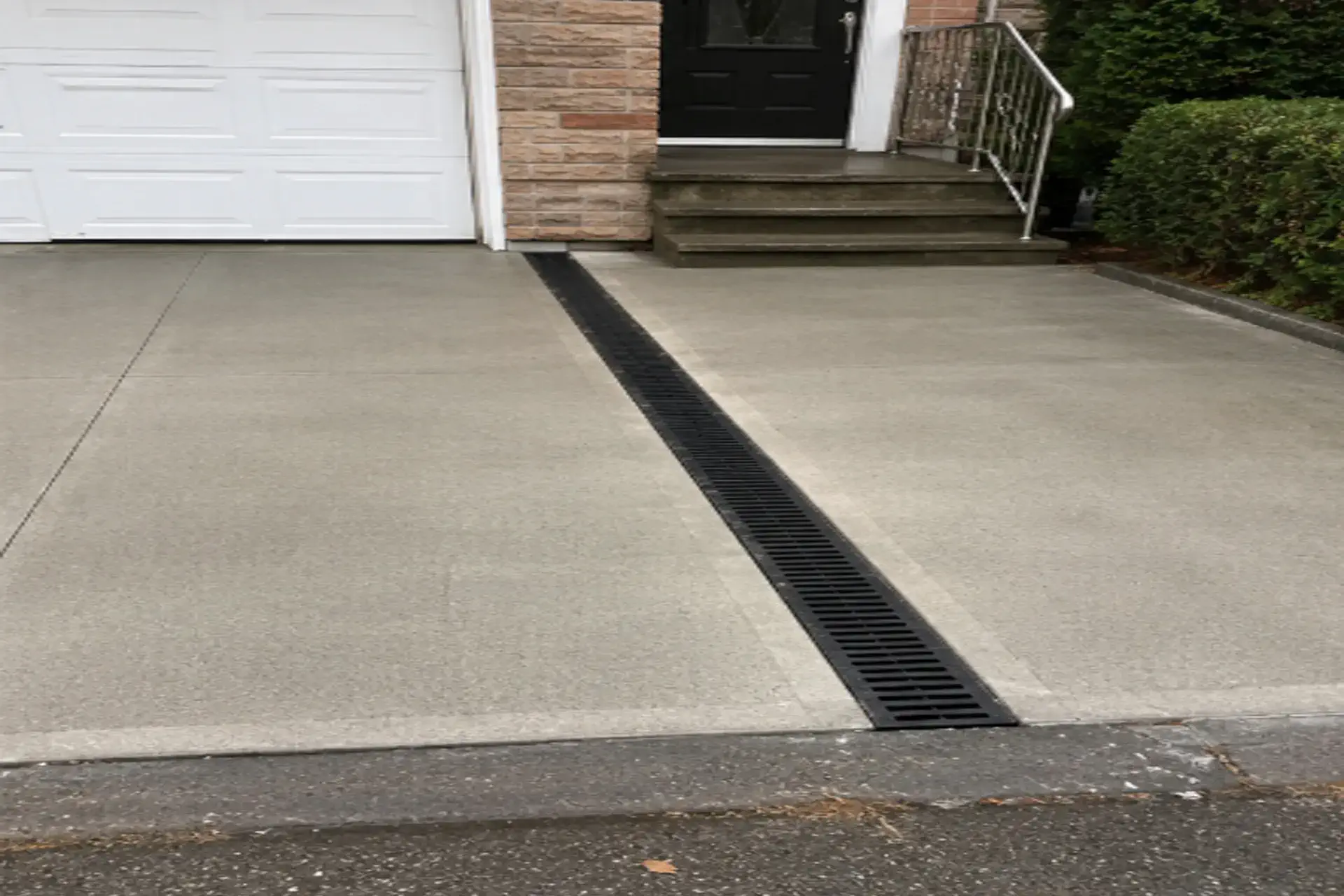 completed-storm-channel-featured 14-foot storm channel installed along the entrance and garage doors of a Flushing NY property.