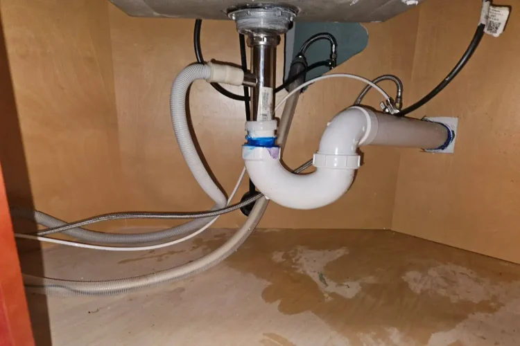 A leaking pipe in the basement of a property in Long Island, NY that will eventually become a source of mold issues in the property if left unrepaired