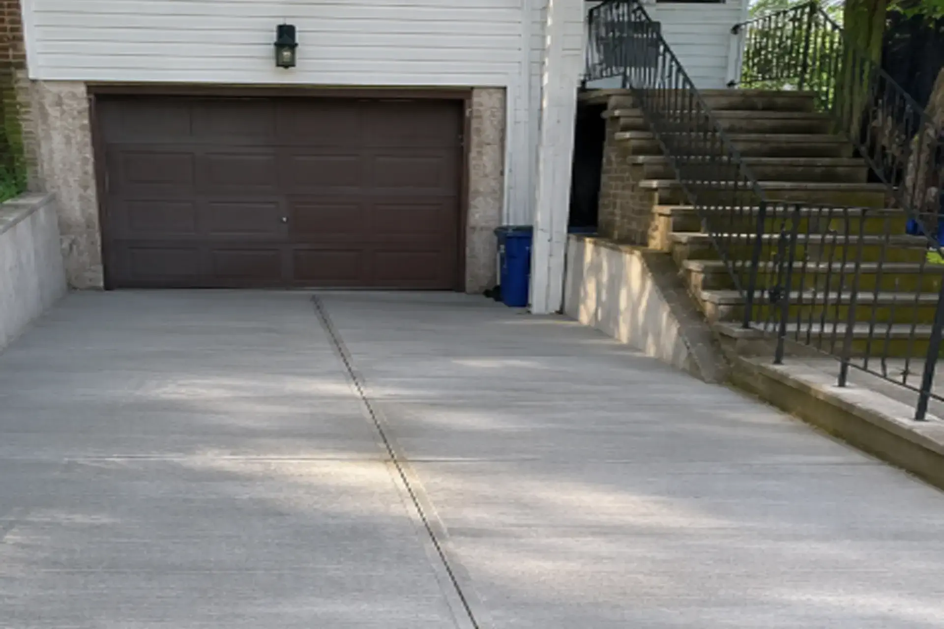 reinforced-concrete-driveway-featured New reinforced concrete driveway completed at a Brooklyn NY residential property after asphalt replacement.