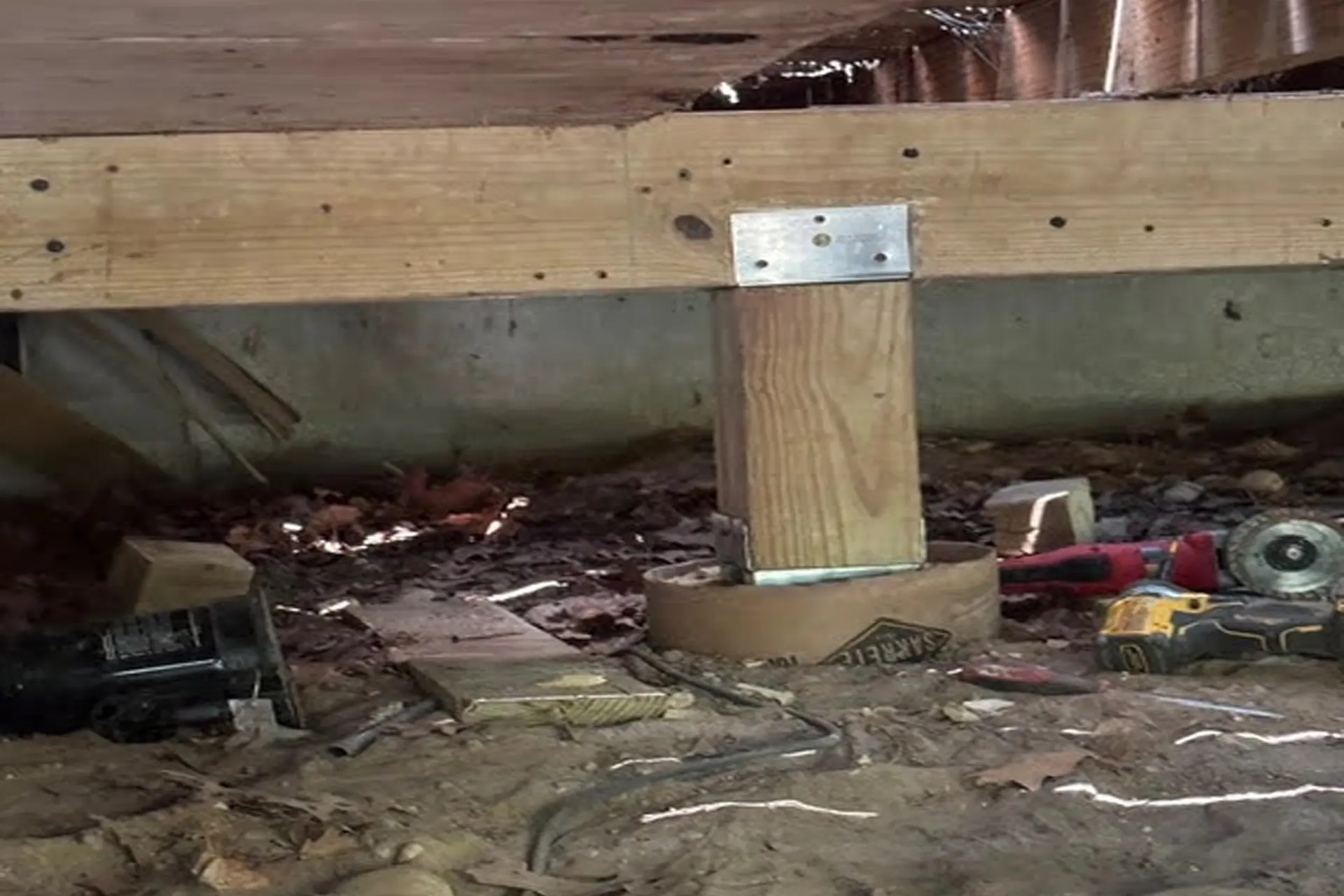 stabilized-floor-and-realigned-sliding-door 6x6 structural support post installed on a new concrete footing for floor stabilization in Shoreham, NY