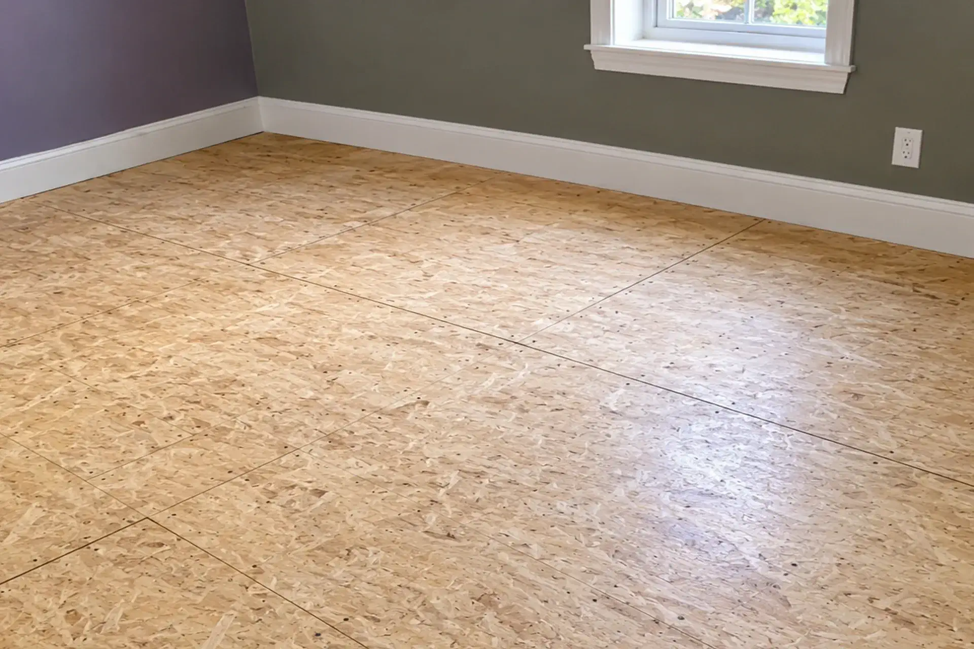 Structural floor repair with reinforced floor joists and new subfloor installation in Floral Park NY